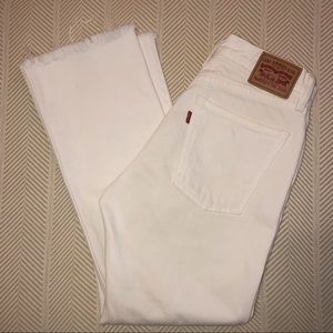 Bone white Levi’s with cropped raw hem